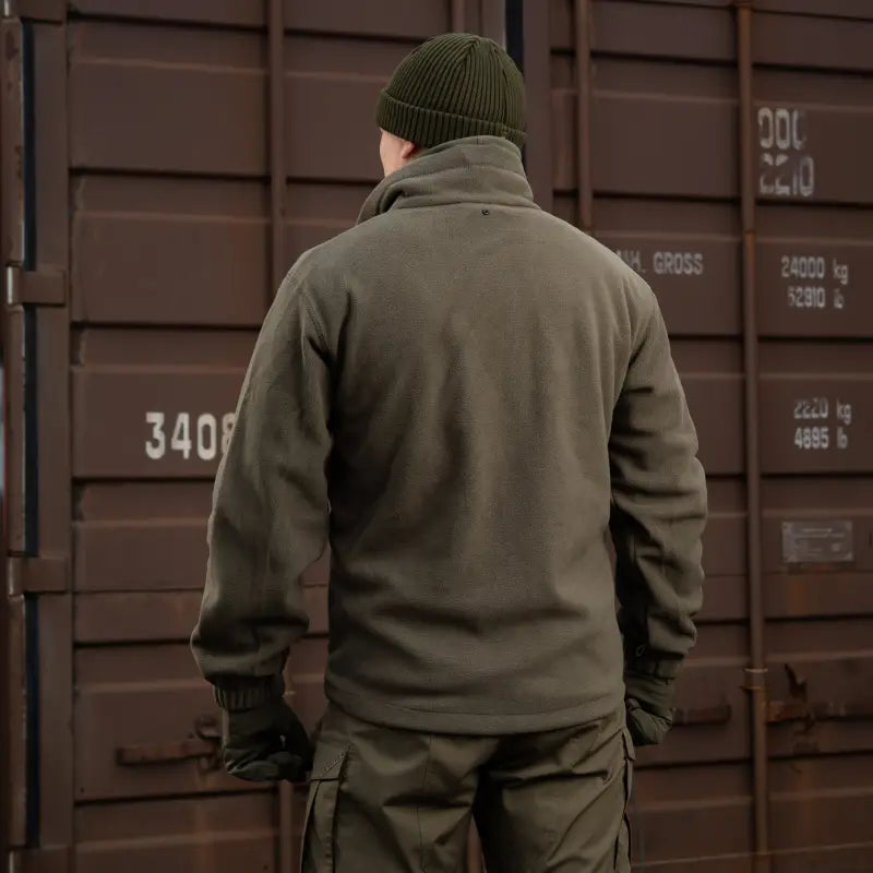 Person wearing olive green M-Tac Soft Shell Jacket with two shoulder pockets