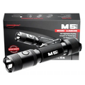 Black tactical LED flashlight with textured grip in E11Gen2 Bundle packaging
