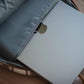 MacBook in gray sleeve inside ECHO EDC Backpack for concealed carry and protection