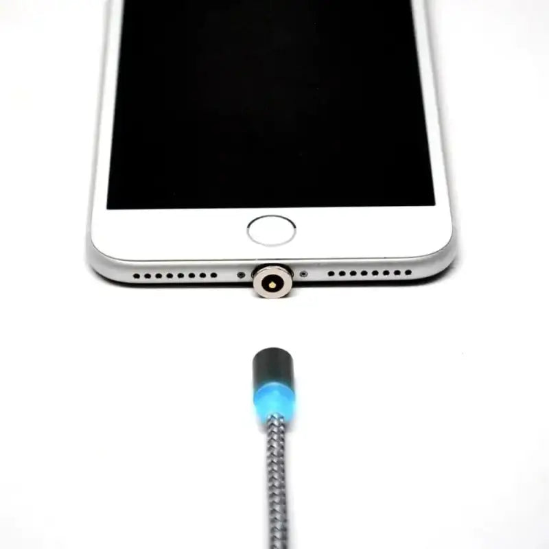 Magnetic USB charging cable with glowing blue tip near iPhone charging port and nylon cord