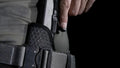 Black handgun in Mainstay Clipless IWB Holster made of mesh material