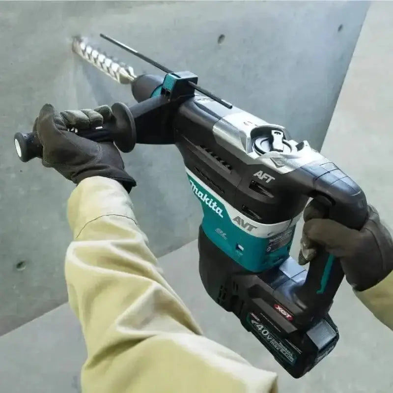 Makita GRH05M1 40V max XGT® Brushless AVT® Rotary Hammer in use by a user