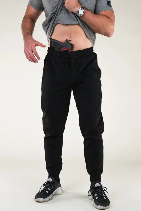 Man in Carrier Traveler Joggers - Midnight Black with concealed carry capability