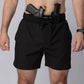 Man wearing Carrier Training Shorts Mk.II with concealed carry and two handguns
