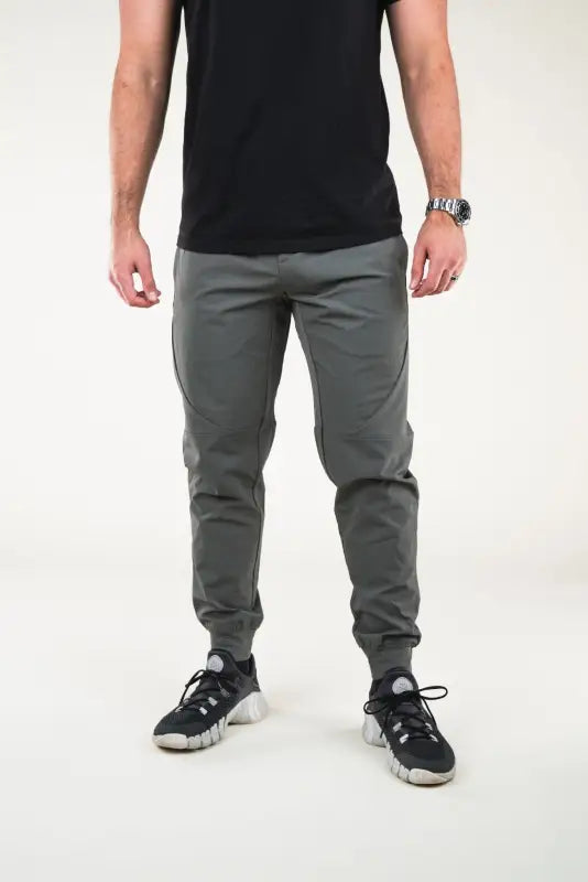 Man wearing Carrier Traveler Joggers in Iron Grey with concealed carry features