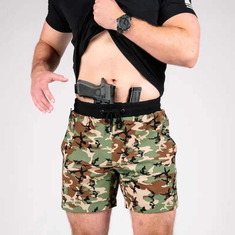 Man displaying concealed carry with Carrier Training Shorts 5 Inseam Printed