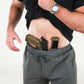 Man showcasing concealed carry with Carrier Traveler Joggers - Iron Grey and retention waistband