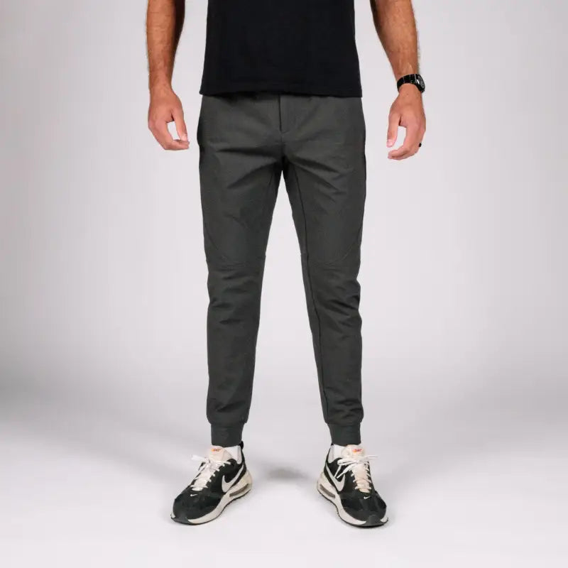 Man wearing gray carrier traveler joggers with concealed carry and carrier retention waistband