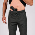 Man with concealed carry gun in waistband wearing Carrier Traveler Joggers with carrier retention waistband