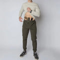 Man with concealed carry in carrier retention waistband of Carrier Traveler Joggers