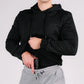 Man concealing handgun in hand pocket of Standoff Concealment Hoodie Mk.II for standoff concealment
