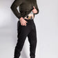Man concealing handgun with Carrier Joggers Mk.II featuring concealed carry and retention belt