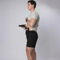 Man holding a handgun wearing Carrier Training Shorts Mk.II for concealed carry