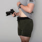 Man holding a handgun in Carrier Training Shorts Mk.II for concealed carry training