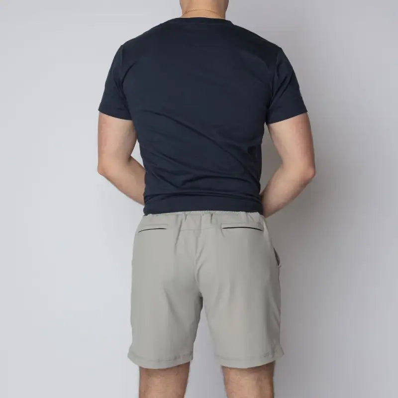 Man wearing navy carrier shorts for concealed carry from Arrowhead Tactical Apparel