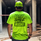 Man in neon safety yellow t-shirt and hard hat promotes workplace safety fashion