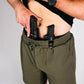 Man wearing Carrier Shorts Mk.II in Olive Drab, featuring concealed carry pockets