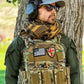 Man in tactical gear wearing Redemption Tactical Crusader 2.0 plate carrier vest with standard 10x12 plate