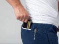 Man’s wallet in pocket with Carrier Joggers Mk.II showcasing concealed carry and retention belt design