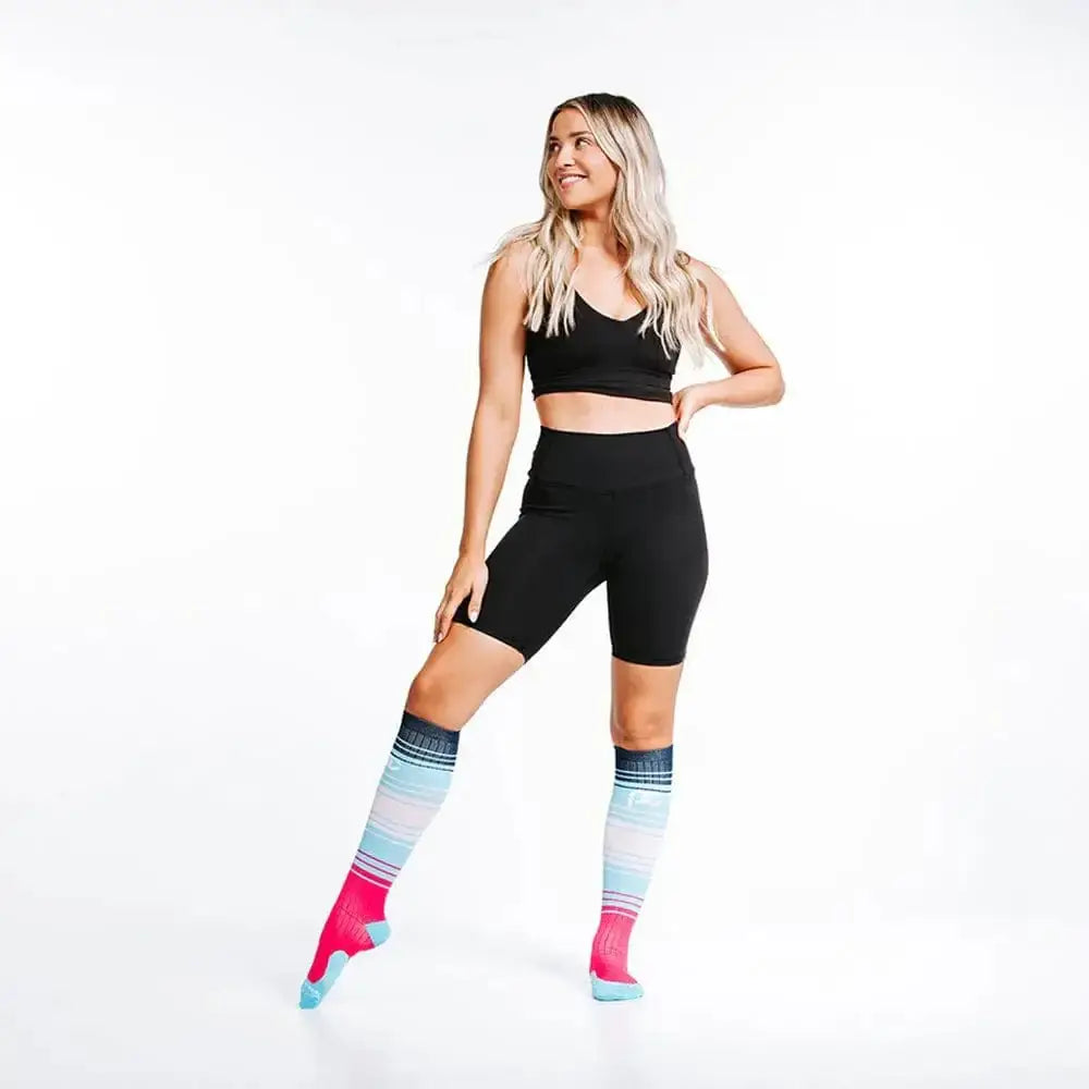 Colorful striped athletic socks named Marathon, Bayou Sunset with black workout attire