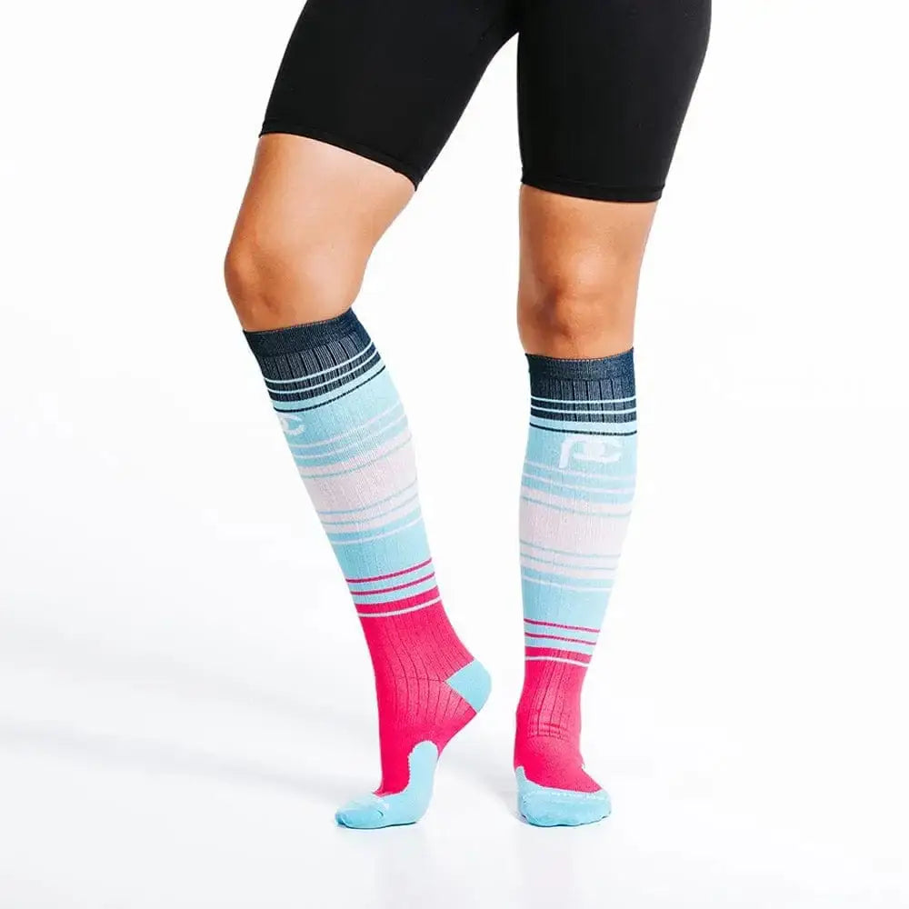 Colorful knee-high socks with pink, blue, and gray stripes inspired by Bayou Sunset