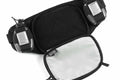 Black fanny pack with zippered compartments and reflective accents for Marathon Gun Pack