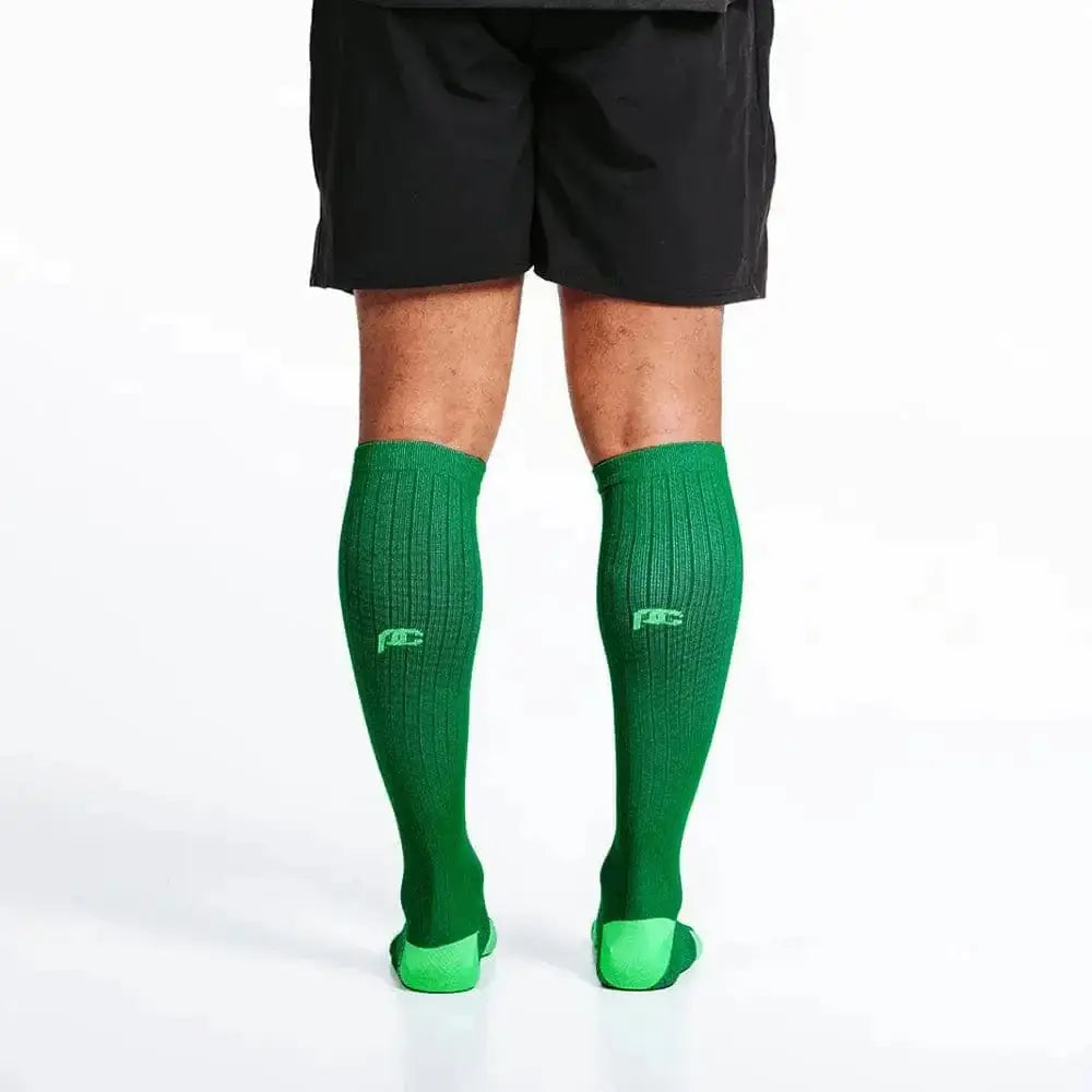 Bright green knee-high athletic socks in Kelly Green for first responders and firefighters