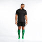 Athletic figure in black gear and bright Kelly Green compression socks for first responders