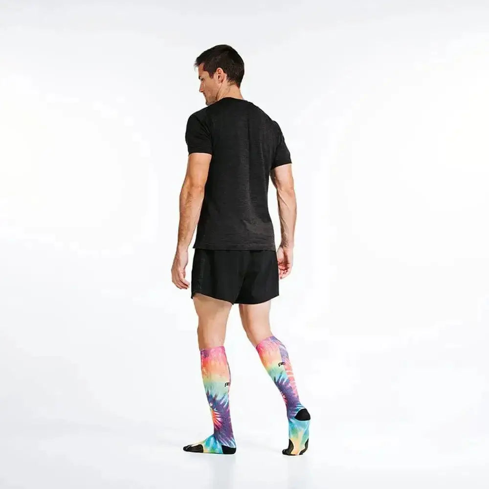 Colorful Rainbow Tie Dye compression socks with black athletic shorts and t-shirt