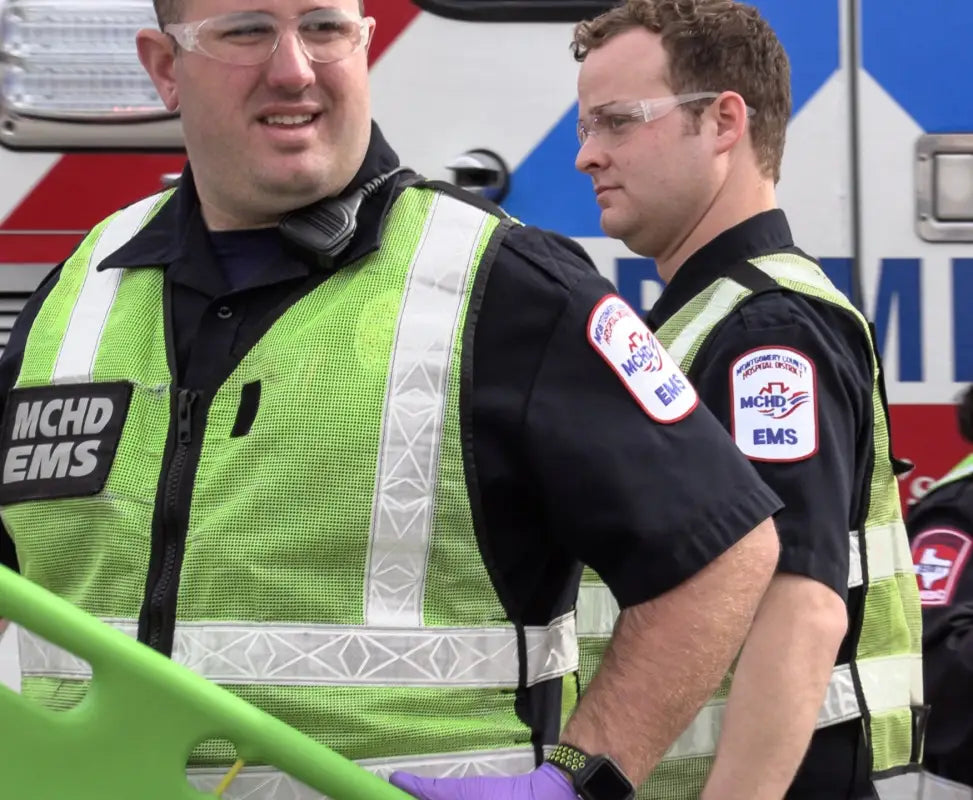 EMS workers in MCHD ANSI II Adjustable Vests adhering to ANSI II standards for safety