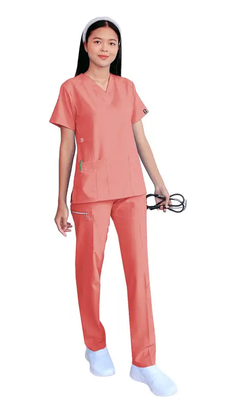 Medical professional in Women’s Gentle Stretch Slim Fit Zipper Set with coral scrubs