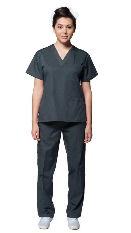 Medical professional in Women’s Classic 8 Pocket Uniform Scrubs with pen slot and white shoes