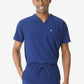 Medical professional in navy blue men’s double-pocket scrub top with v-neck design