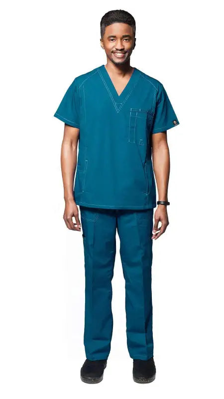 Medical professional in teal multi pocket utility medical scrubs and black shoes