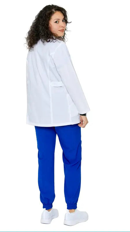 Medical professional in women’s princess-cut short lab coat and bright blue scrubs