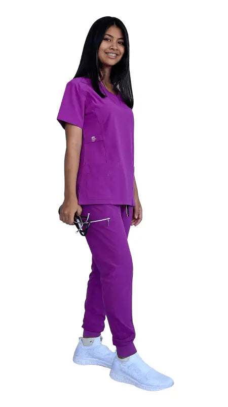 Bright purple Women’s Stretch Slim Fit Zipper Jogger Uniform with white sneakers