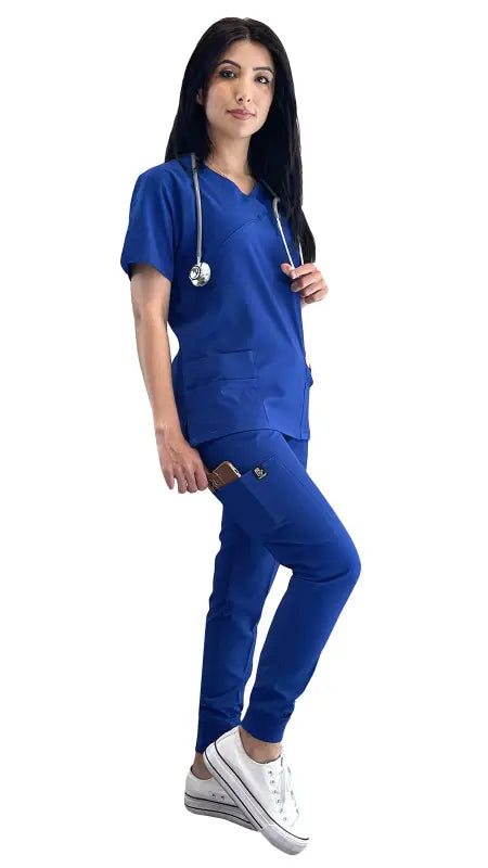 Women’s 4-Way Extreme Stretch Jogger Scrubs in royal blue with white sneakers and stethoscope