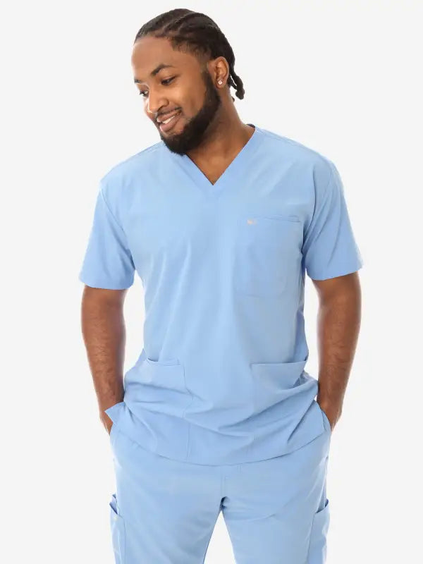 Light blue men’s five-pocket scrub uniform featuring v-neck top and matching pants