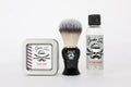 Men’s shaving kit with soap tin, brush, and skull design aftershave bottle for face shave