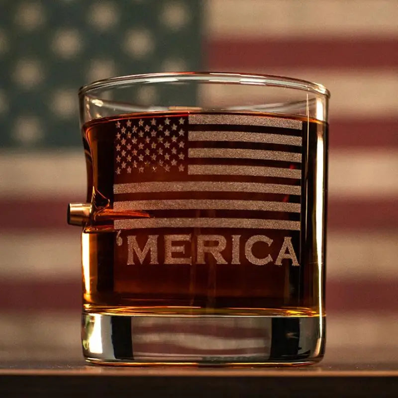 Glass tumbler with amber liquid, etched American flag, and Merica text for whiskey lovers