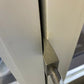 Metal door hinge mechanism on white surface, part of 12’’ XL Ti Hooligan Forced Entry Tool