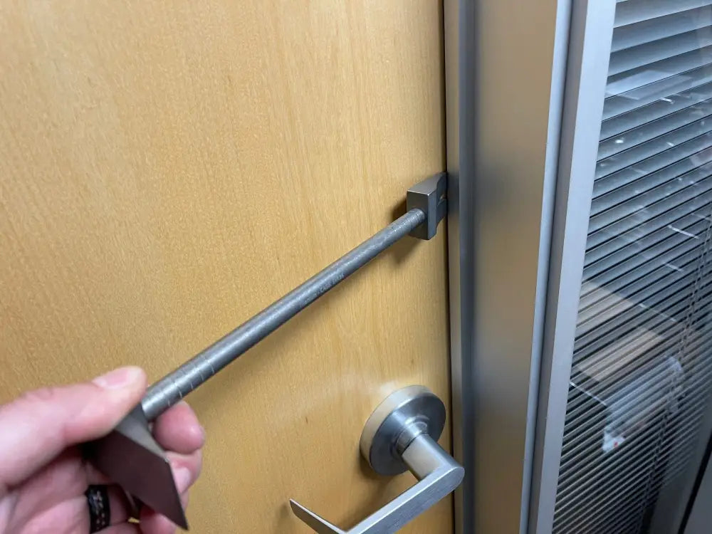 Metal door security bar installation using the 12’’ XL Ti Hooligan Forced Entry Tool