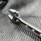 Metal nail clipper with curved cutting edge next to 8 Inch Titanium Adjustable Wrench