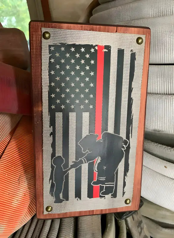 Metal Firefighter Thin Red Line Flag featuring children silhouettes and American flag design