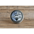 Metal tin of Ol’ Fashion Beard Balm featuring skull logo and stars and stripes design