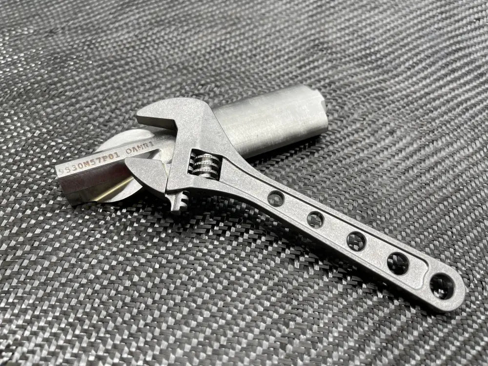 Metallic adjustable wrench with drilled handle holes - Titanium 6 Inch NSN Pending