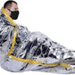 Metallic silver emergency space blanket retaining body heat around masked individual