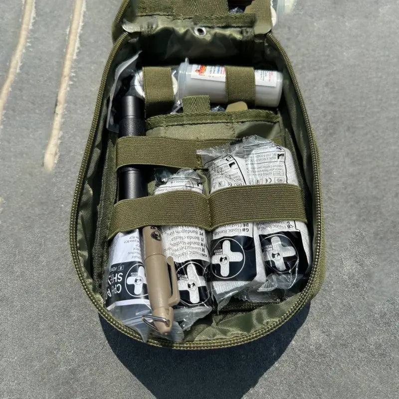 Military-style medical pouch with first aid supplies in The First Responder IFAK Kit