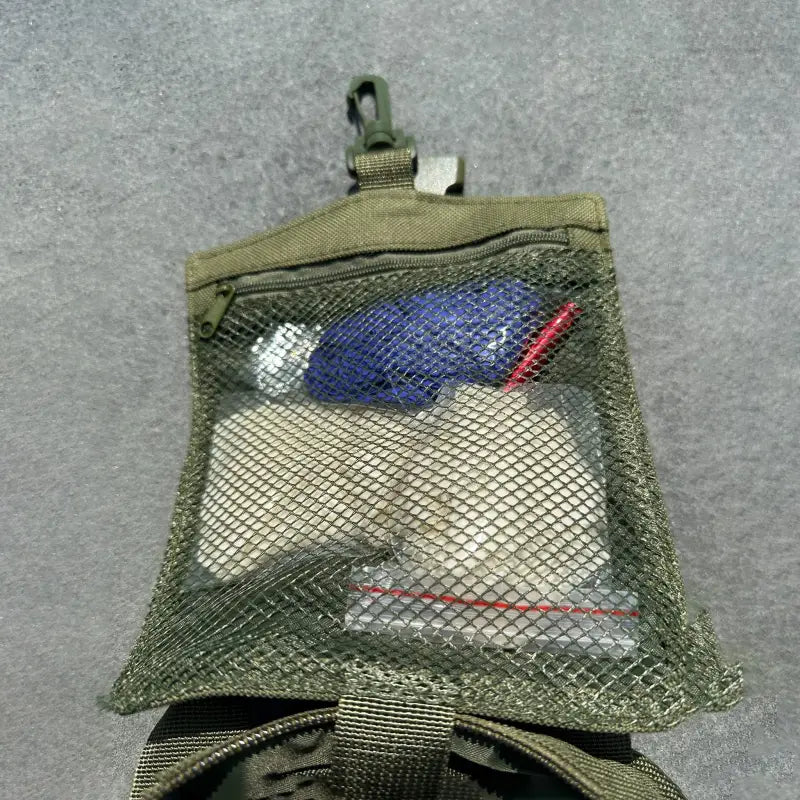 Military-style mesh pouch with personal items in The First Responder IFAK Kit