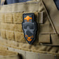 CM-8M PVC Morale Patch with skull design and orange accents on tan tactical gear